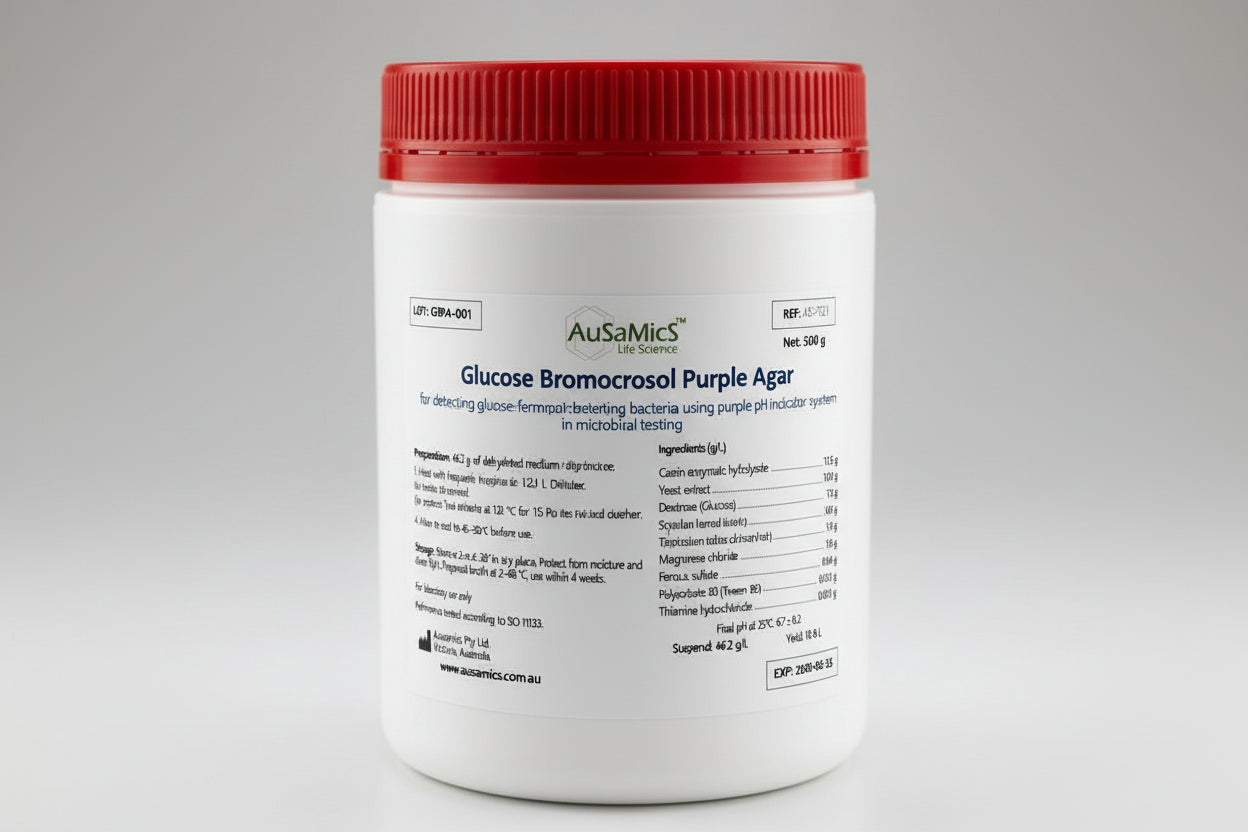 Container of AusaMics Glucose Bromocresol Purple Agar with red lid on a gray background